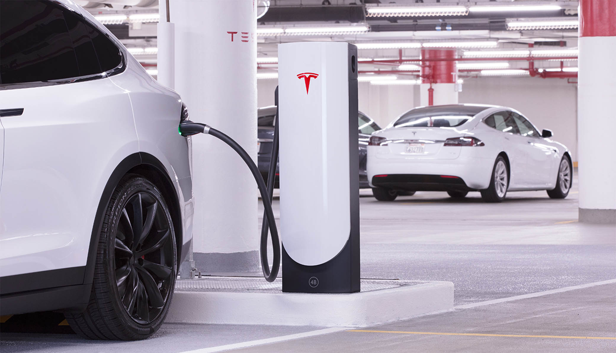 Tesla at supercharger.jpg