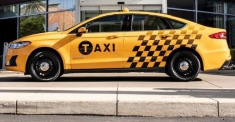 Automaker says Fusion Hybrid Taxi expected to deliver 38 mpg combined.