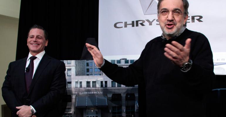 Marchionne right and Detroit businessman Dan Gilbert talk about Chrysler House the auto makerrsquos new office in the city
