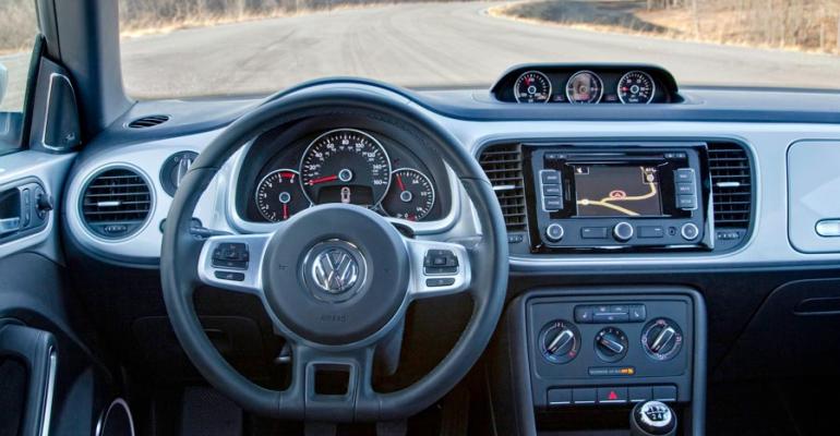 Nostalgic cues bodycolor trim distinguish new VW Beetle