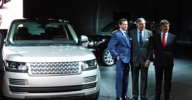 John Edwards Land Rover brand director Chairman Ratan Tata and Ralf Speth JLR CEO in Paris