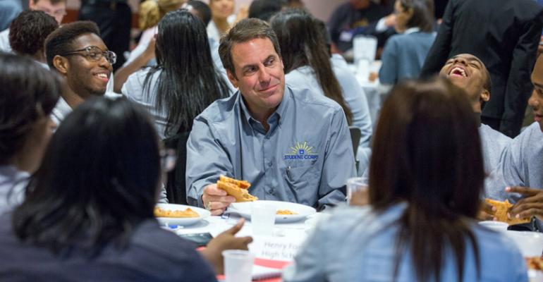 Reuss at lunch Monday with members of a group of 110 Detroitarea high school students being hired by GM as paid summer interns