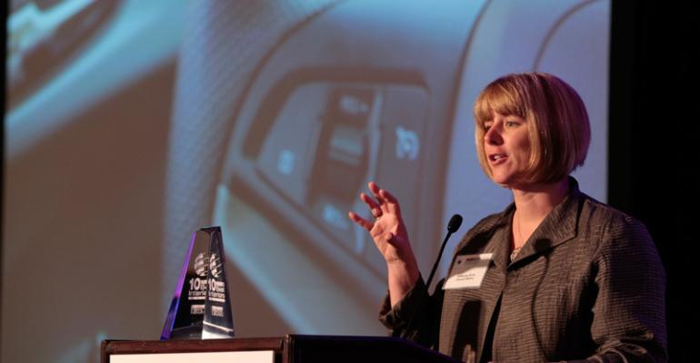 GMrsquos Kathy Sirvio accepts Wardrsquos 10 Best Interiors trophy at last yearrsquos conference for Chevy Sonic and this year will accept for Chevy Spark