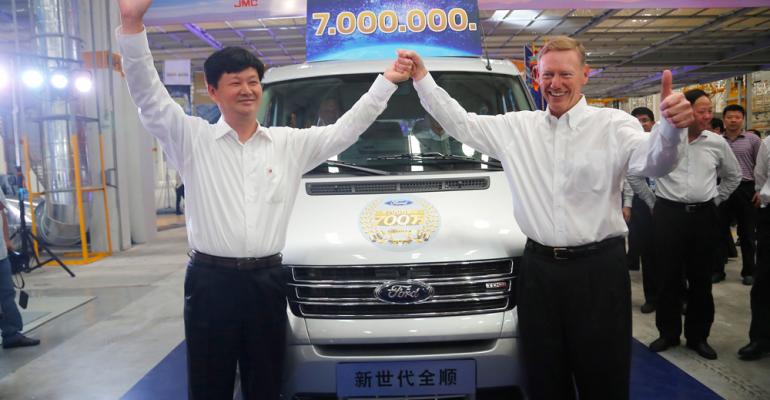 Ford CEO Alan Mulally and JMC Chairman Wang Xigao celebrate opening of new assembly plant