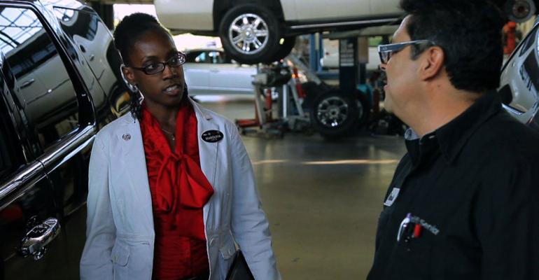 GM softwareintegration engineer Marquita Adams talks with Herb Figueroa service technician at Casa de Cadillac in Sherman Oaks CA