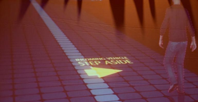 Slide at Valeo press conference illustrates how light projection can be used to warn pedestrians