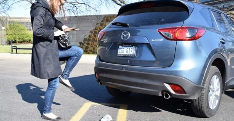 Editor Schweinsberg recreates her onelegged hop to find keyfob CX5 demo vehicle only ie tailgate release is in middle