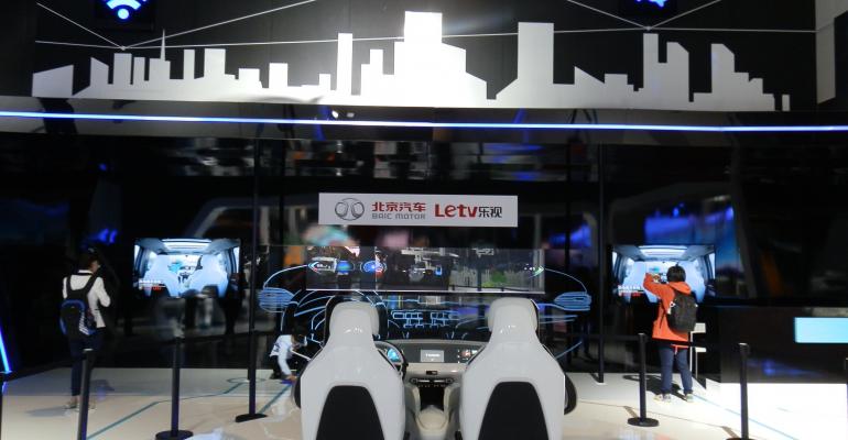 LeTV shows console of smart car it is working on with Beijing Auto at the Shanghai Auto Show in April but also aims to produce its own smart car