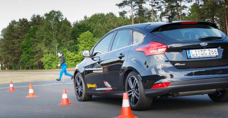 Ford Focus with automatic emergency braking easily avoids hitting child dummy 