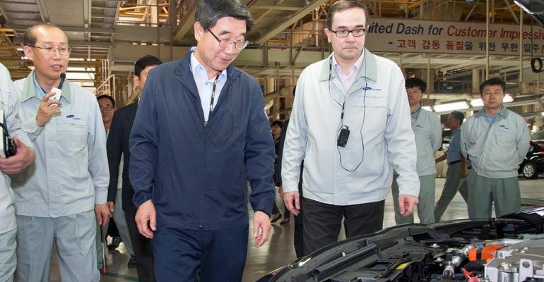 Korea Labor Minister Lee Kikweon and RSM CEO Francois Provost walk Busan plant