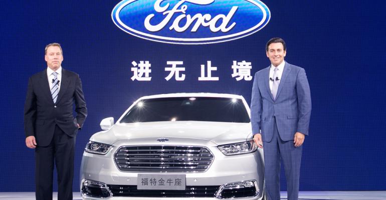 Ford Chairman Bill Ford left President and CEO Mark Fields introduce Taurus at Shanghai auto show
