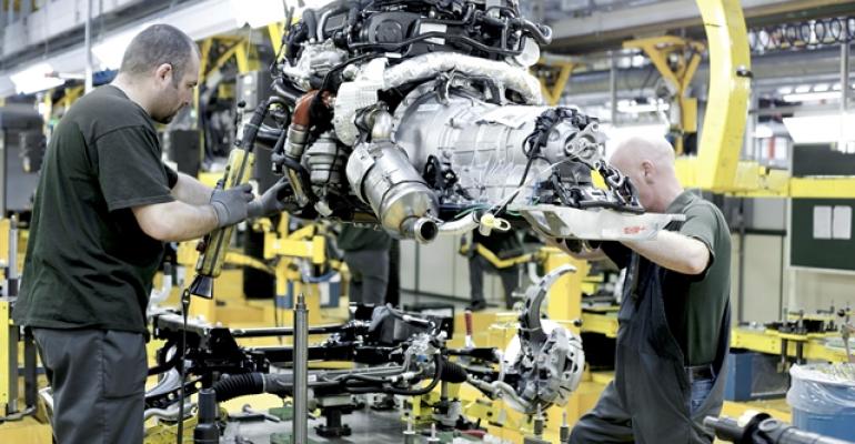 Engine installation at Jaguar manufacturing plant in Castle Bromwich