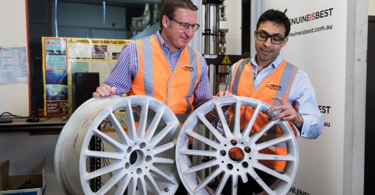 FCAI representative Mark Skaife left examines real fake wheels with LMATS materials engineer Yashwin Mahadea
