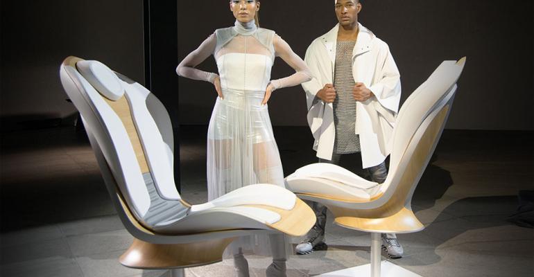 Models posing with futuristic seats set scene for Crafted by Lear launch 