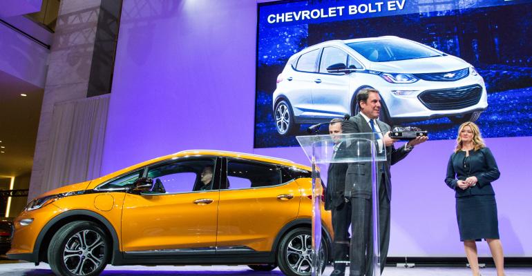 GM Executive Vice President Global Product Development Mark Reuss GM executive vpGlobal Product Development center Chevrolet Bolt EV Chief Engineer Josh Tavel and Pam Fletcher executive chief engineerAutonomous amp Electrified Vehicles and New Technology accept NACTOY award for Bolt