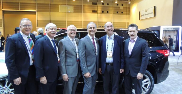 While walking the show floor today NADA officers stop by the General Motors exhibit From left Lutz Carlson Welch Scarpelli and GM vice presidents Steve Hill and Kurt McNeil