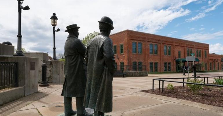Statues of Dort and Durant right gaze upon restored Factory One