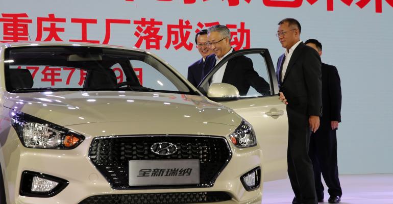 Hyundai Vice Chairman Chung front right inspects vehicle at Hyundairsquos fifth China plant with Chongqing Mayor Zhang front left
