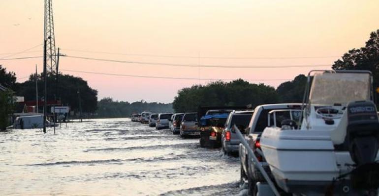 Vehicles on flooded Highway 90 in China TX after Hurricane Harvey hit   