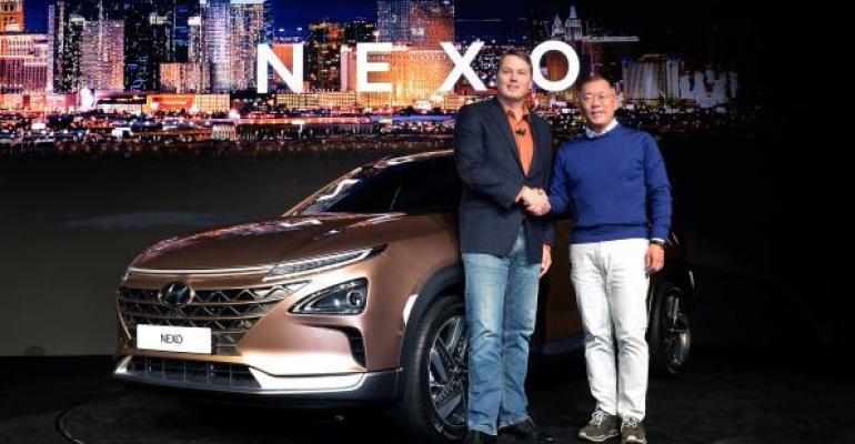 Aurora Innovation CEO Urmson left Hyundai Motor vice chairman Chung introduce NEXO fuelcell vehicle at CES in January