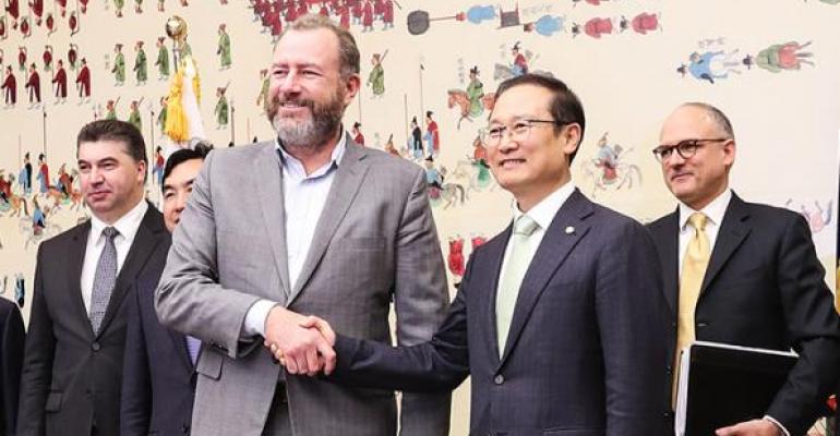 GM president Ammann front left with Korean Assemblyman Hong who helped broker settlement