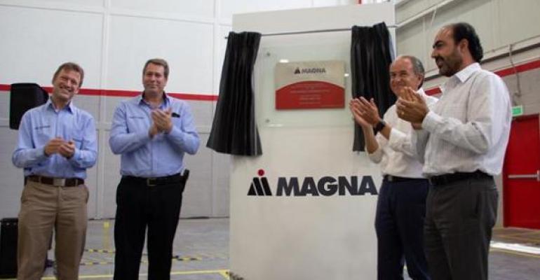 San Luis Potosiacute Gov Carreras Lopez second from right joins Magna executives in celebrating grand opening of new body and chassis manufacturing facility 