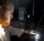 Mark Bissett testing solar cell under solar simulator light source