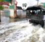 Thai Army truck driving through flooded street in Bangkok to help flood victims