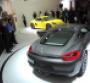 Porche unveils gray Cayman and yellow Cayman S at auto show media event 