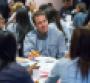 Reuss at lunch Monday with members of a group of 110 Detroitarea high school students being hired by GM as paid summer interns