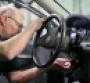 Auto technician Gary Pittam replaces ignition switch on Cobalt at Al Serra Chevrolet in Grand Blanc MI 