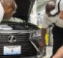 Lexus Georgetown empolyees check tolerances between ES39s spindle grille sheetmetal