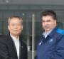 CEO Kazem right welcomes Korea Development Bank Chairman Lee to GM Korea headquarters April 6