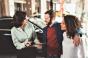 Car saleswoman with customers (Elead).png