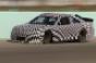 Camouflaged  Chevy SS racecar being tested at HomesteadMiami Speedway in preparation for 2013 NASCAR season also will compete at Daytona 500