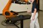 Kuka employee demonstrates safeoperations robotic cell