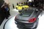 Porche unveils gray Cayman and yellow Cayman S at auto show media event 