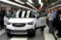 Opel President and CEO Neumann center right OpelVauxhall vice presidentmanufacturing Kienle prepare to drive first Opel Crossland X off assembly line 