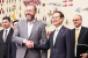 GM president Ammann front left with Korean Assemblyman Hong who helped broker settlement